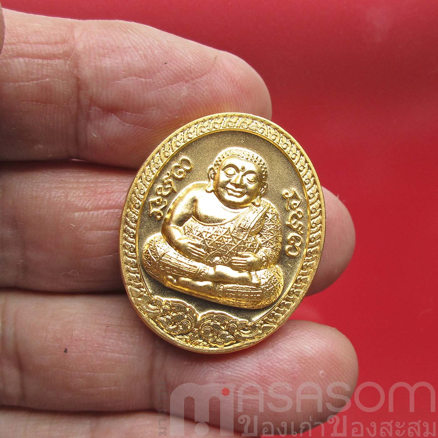 เหรียญพระสังกัจจายน์อุ้มทรัพย์